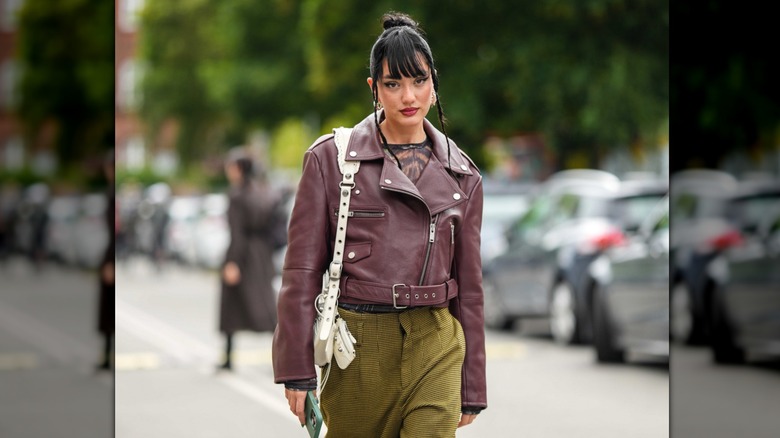 Woman wearing plum leather moto jacket