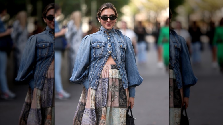 Woman wearing denim jacket and skirt