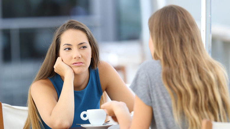 woman looking bored while listening