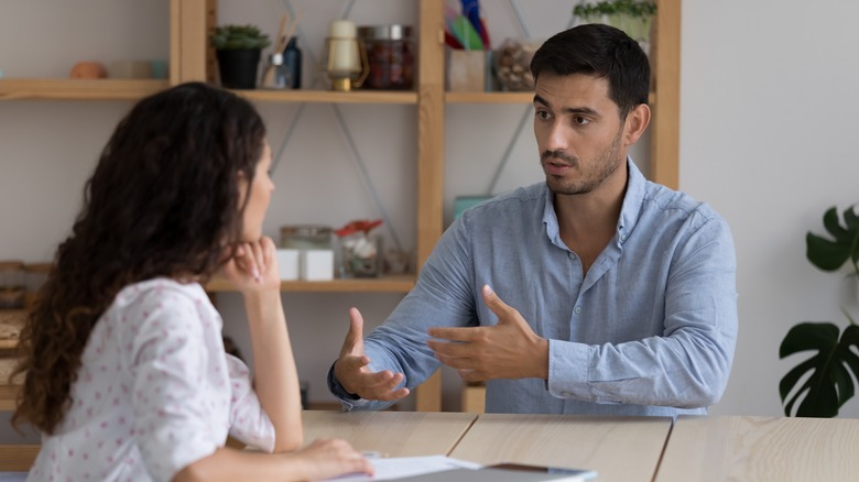 woman listening to man talk