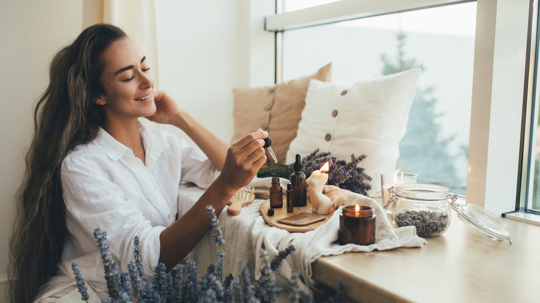 Woman using oils at her home