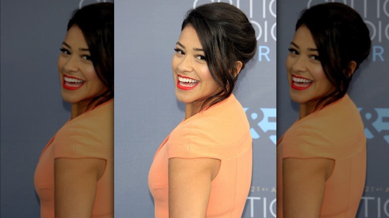 Actor Gina Rodriguez posing, smiling