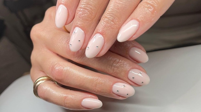 rounded nude nails with rhinestones