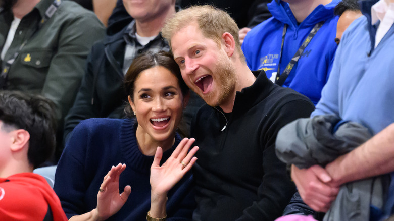 Prince Harry and Meghan Markle smiling together.