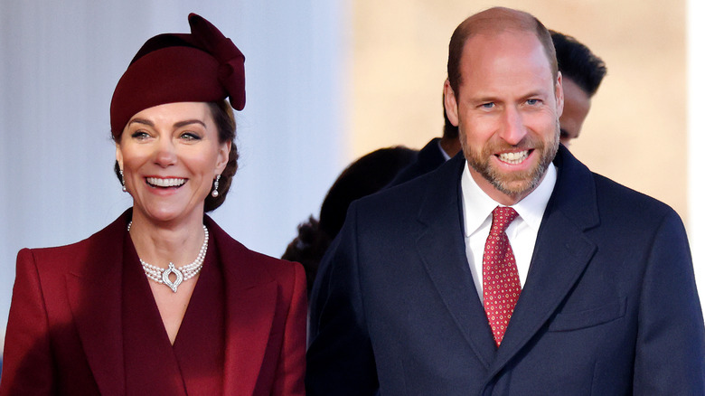 Prince William and Kate Middleton smiling together.