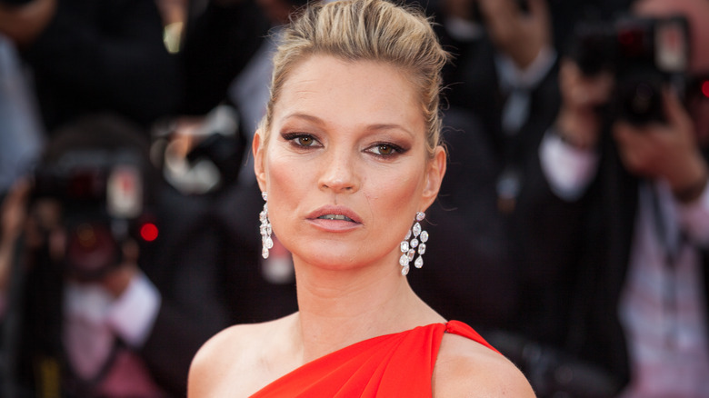Kate Moss with statement earrings