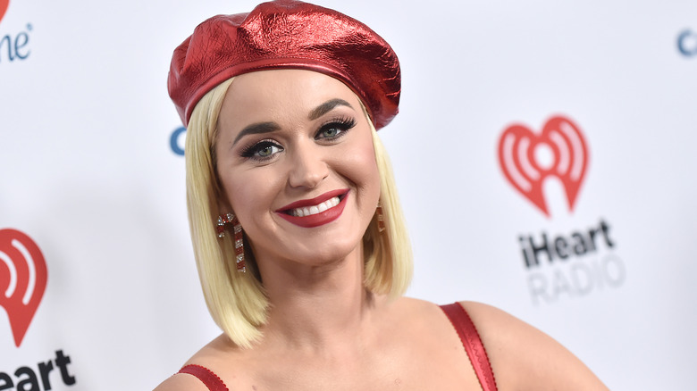 Katy Perry with a red hat