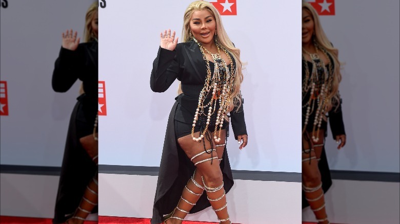 Lil Kim with jewelry on red carpet