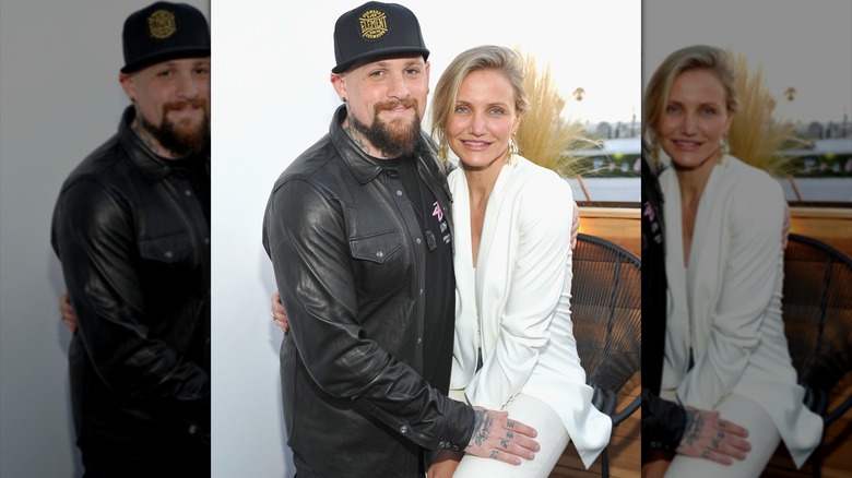 Cameron Diaz posing with Benji Madden, wearing all white