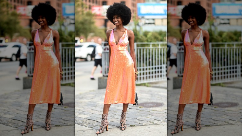woman in orange chainlink dress