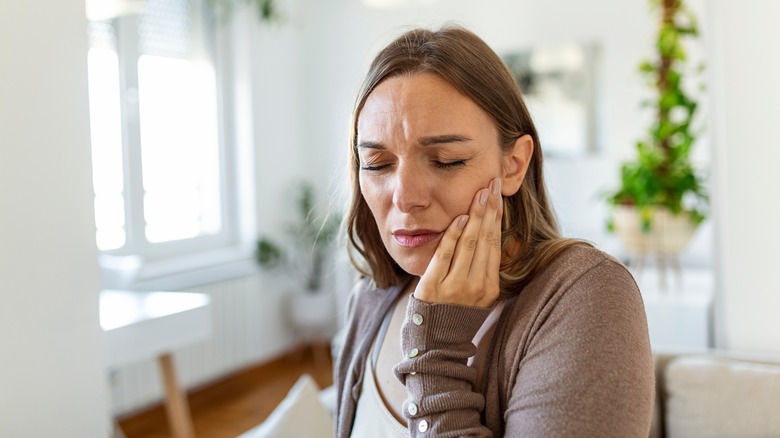woman with cheek pain