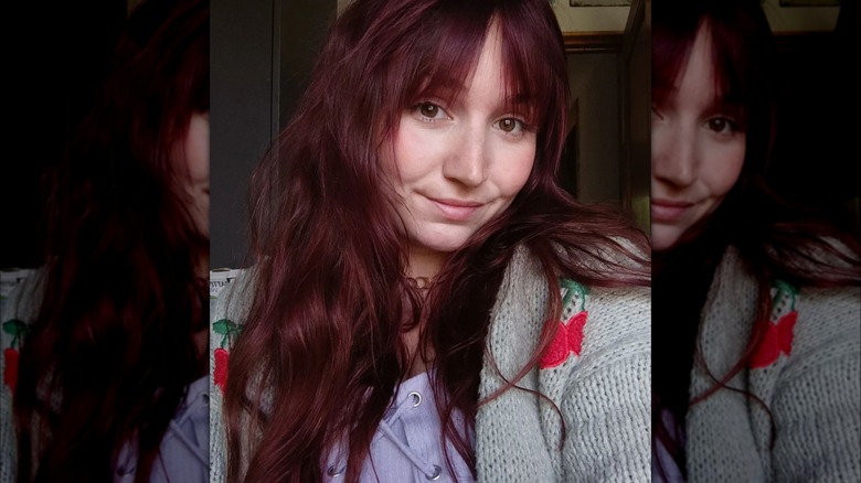 Wavy red hair with bangs
