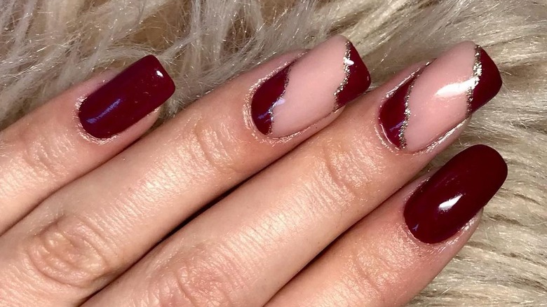 woman with cherry mocha nails