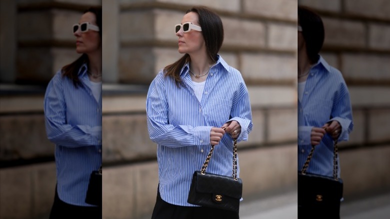 woman in button-down shirt and cami