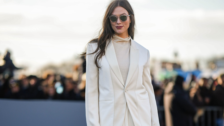 woman in neutral blazer and turtleneck