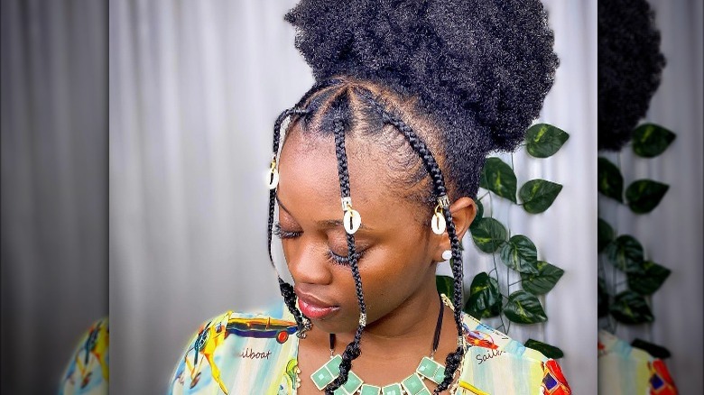 A woman with bejeweled braids