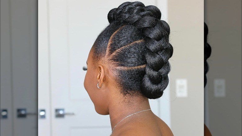 A woman with a braided updo