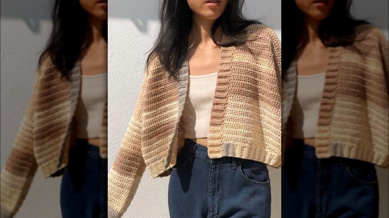 Woman wearing beige crochet jacket