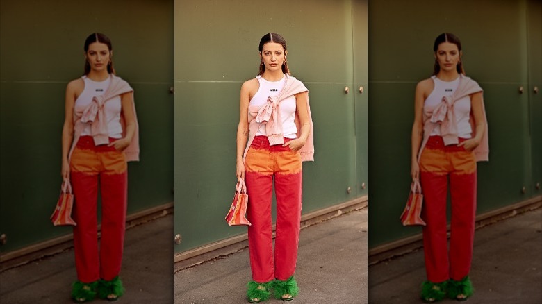 woman with sweater across body