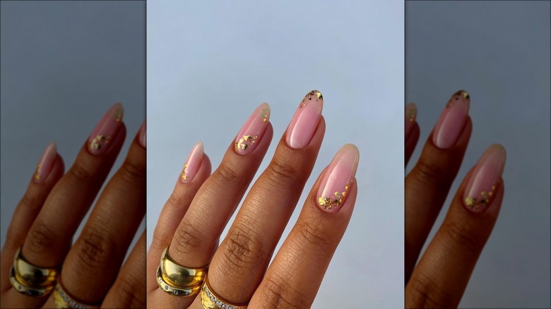 Woman with gold nails