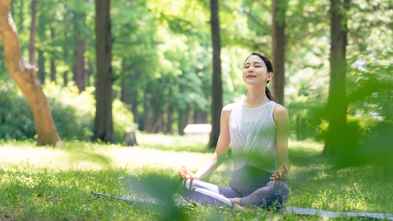 Woman meditating in nature