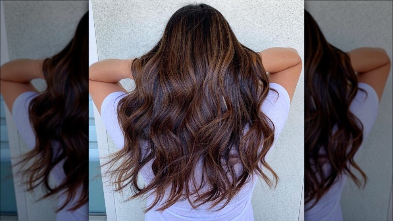 woman with chocolate silk balayage