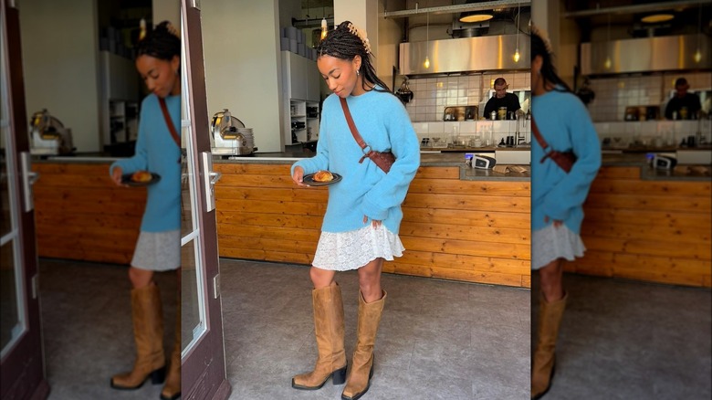 knee-high tan cowboy boots and skirt