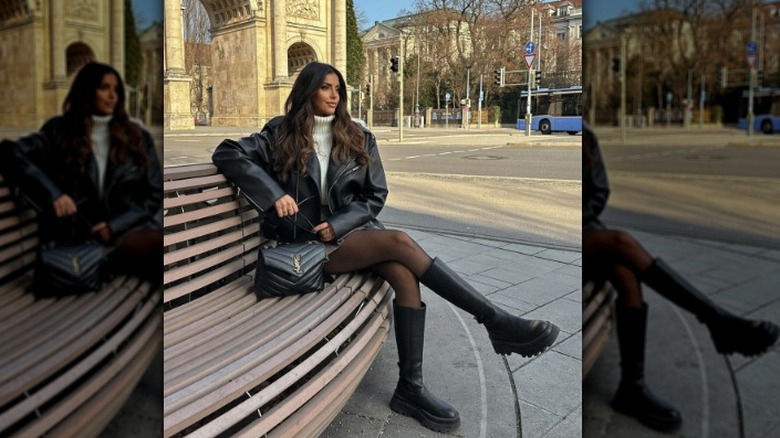 woman wearing chunky boots with a miniskirt