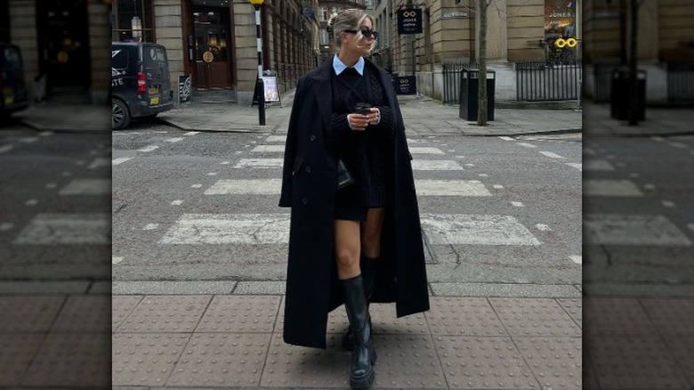 woman wearing chunky boots with a dress