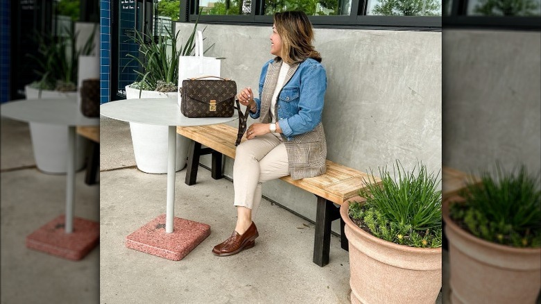 woman wearing brown loafers