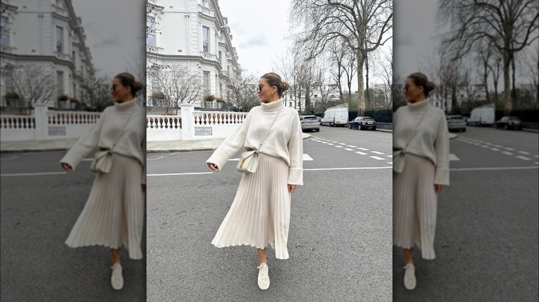 woman in skirt and sneakers