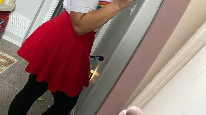 Red circle skirt over dark tights