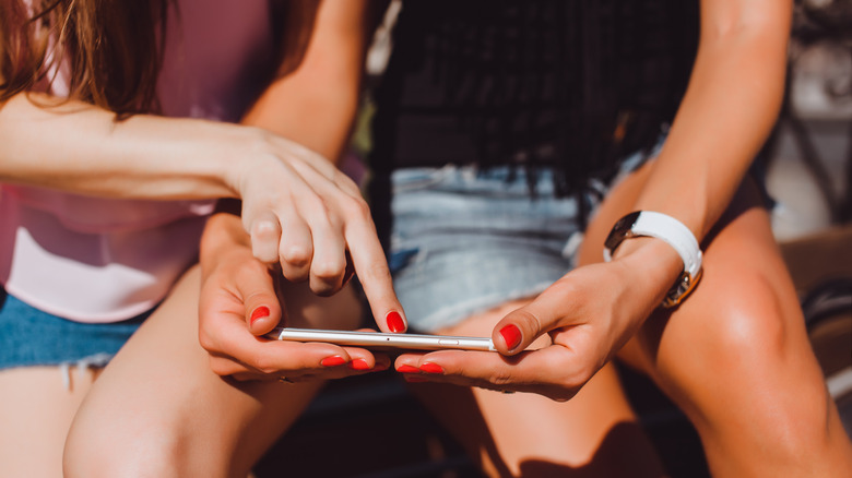 two women using iPhone