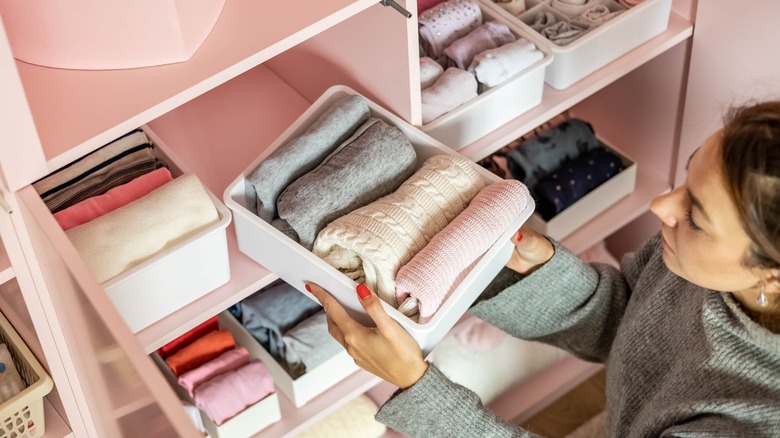 woman packing away her clothes