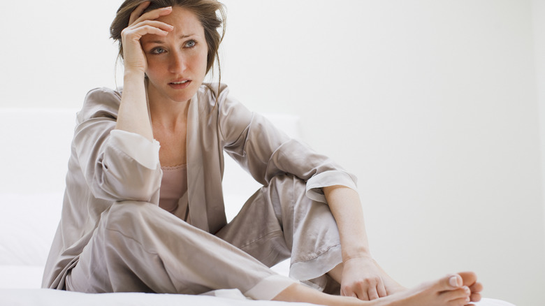 worried woman wearing pajamas