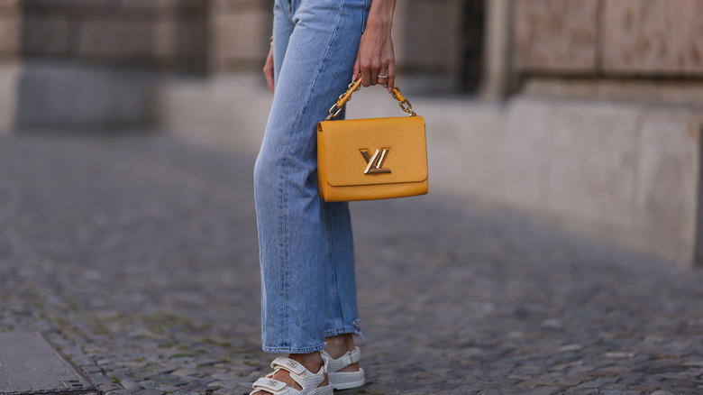 woman wearing straight-leg jeans