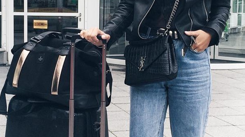 Woman wearing belt at airport