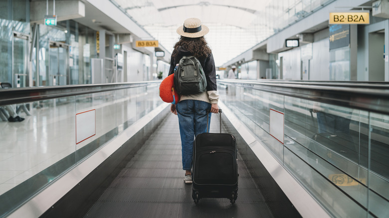 Woman wearing hat in airport