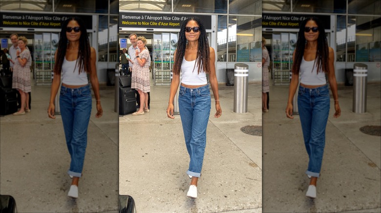 Woman wearing tank top in airport