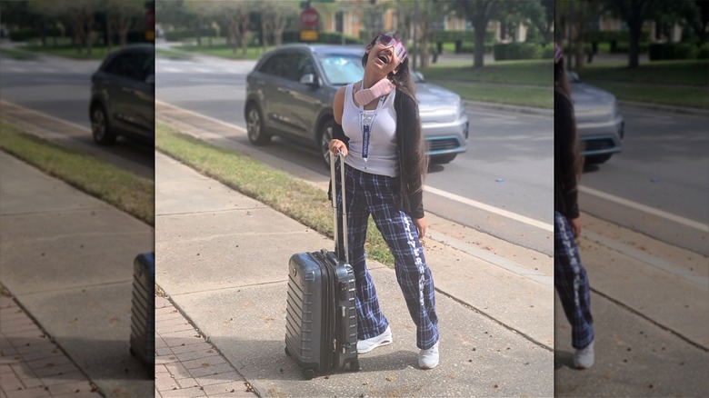 Woman wearing pajamas to airport