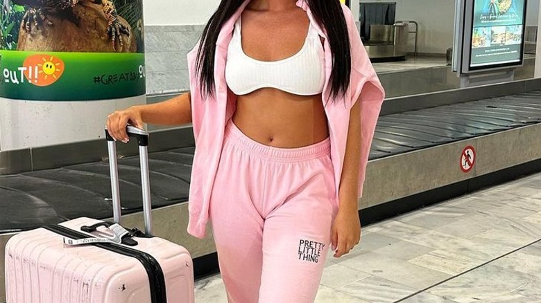 Woman wearing bra in airport