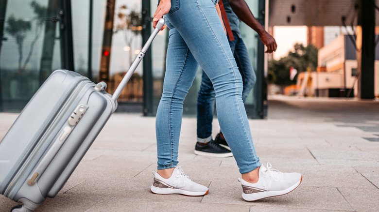 Woman wearing sneakers at the airport