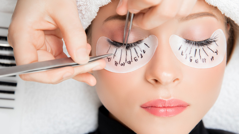 Individual lash extensions being applied