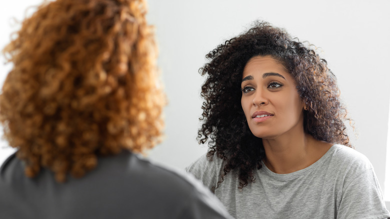 A woman sad while talking