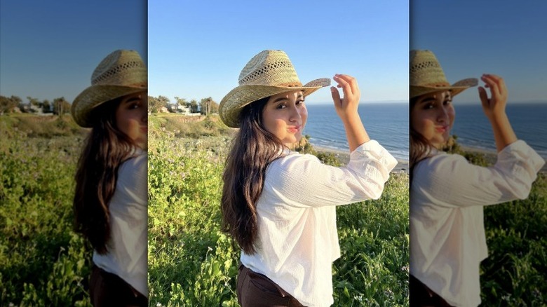 woman wearing shirt and cowboy hat