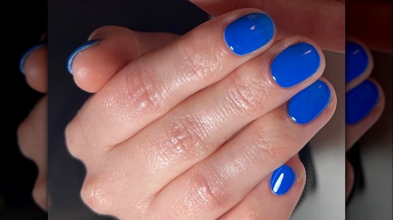 Close up of cobalt blue fingernails 