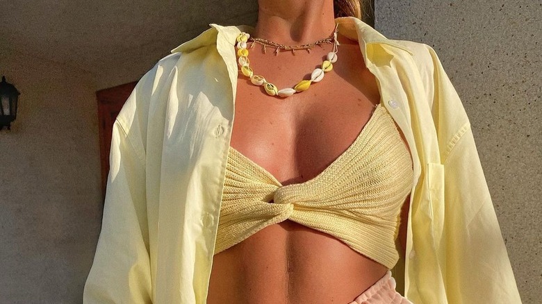 woman wearing shell necklace