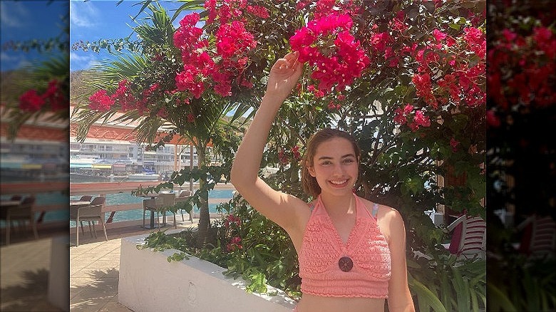 woman wearing orange halter top