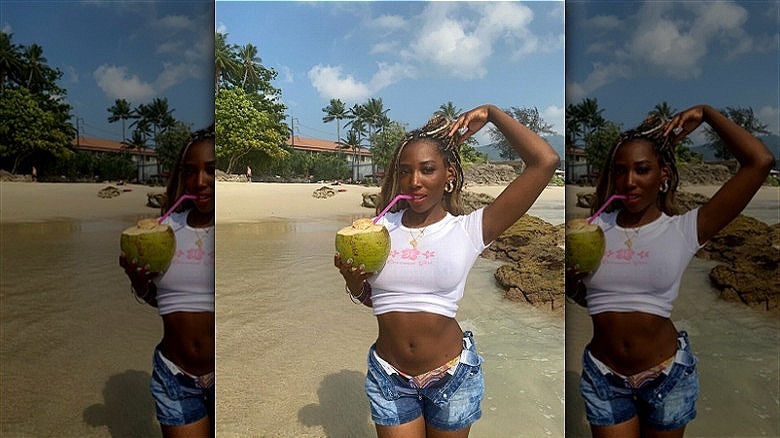 woman drinking from coconut