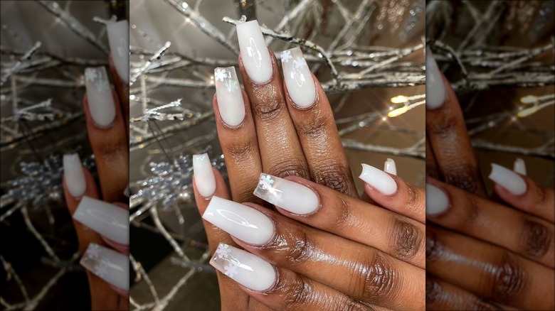 hands with coconut milk nails